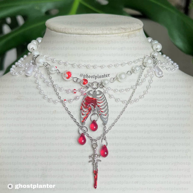 Silver Steel Backstabber Necklace
